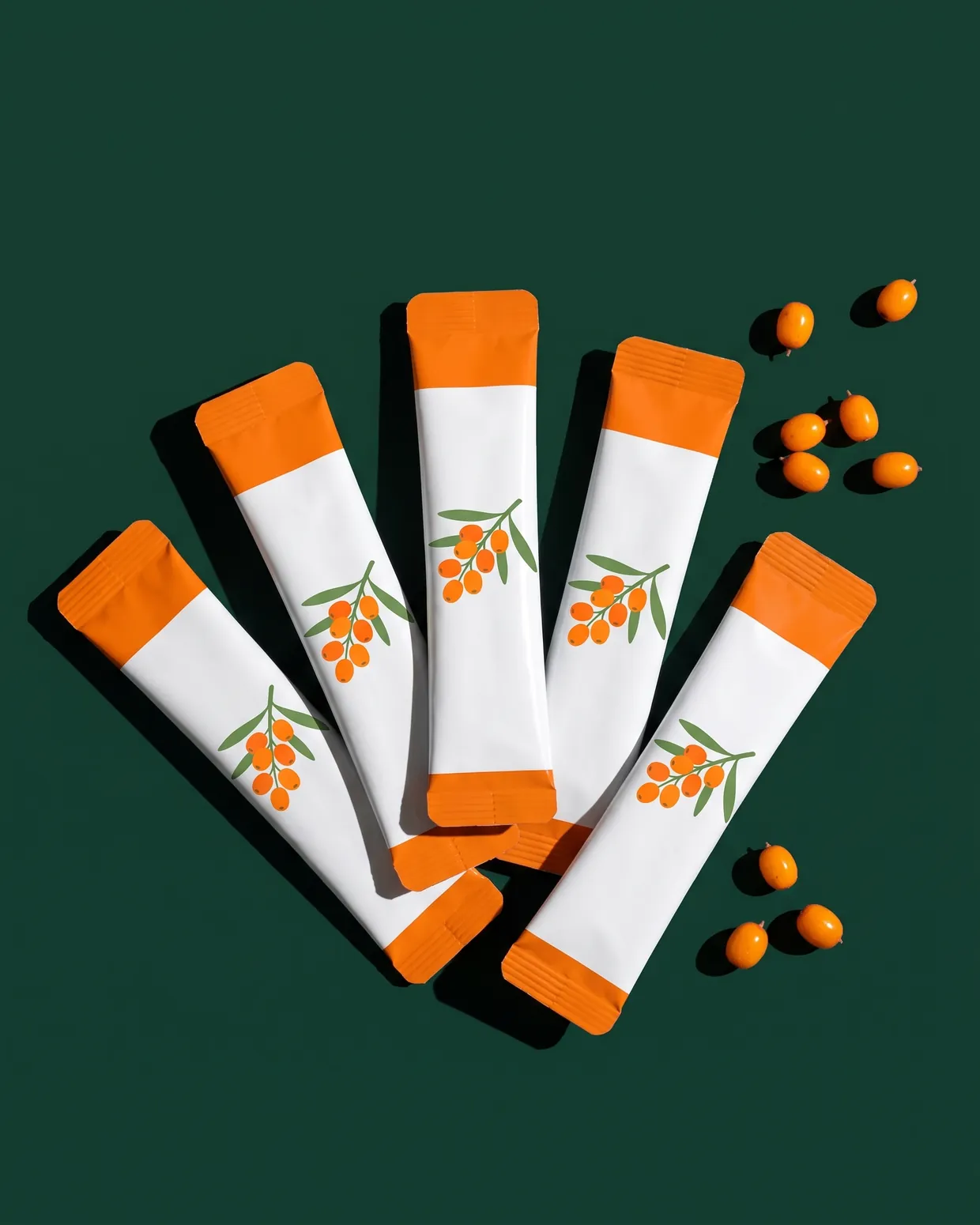 Five sachets fanned out on pine green
