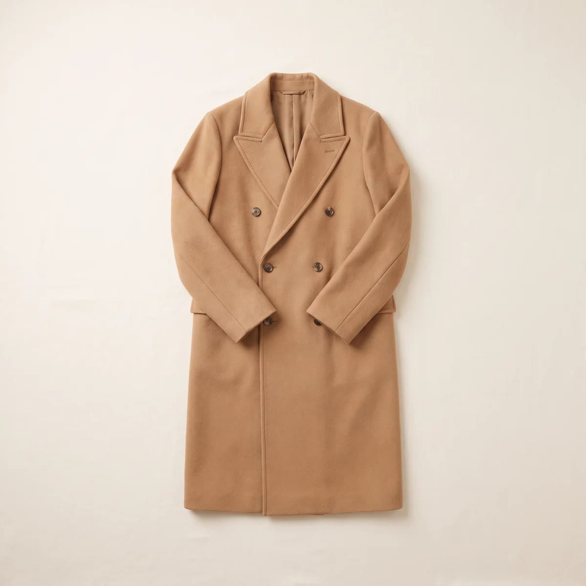 Camel wool coat laid flat