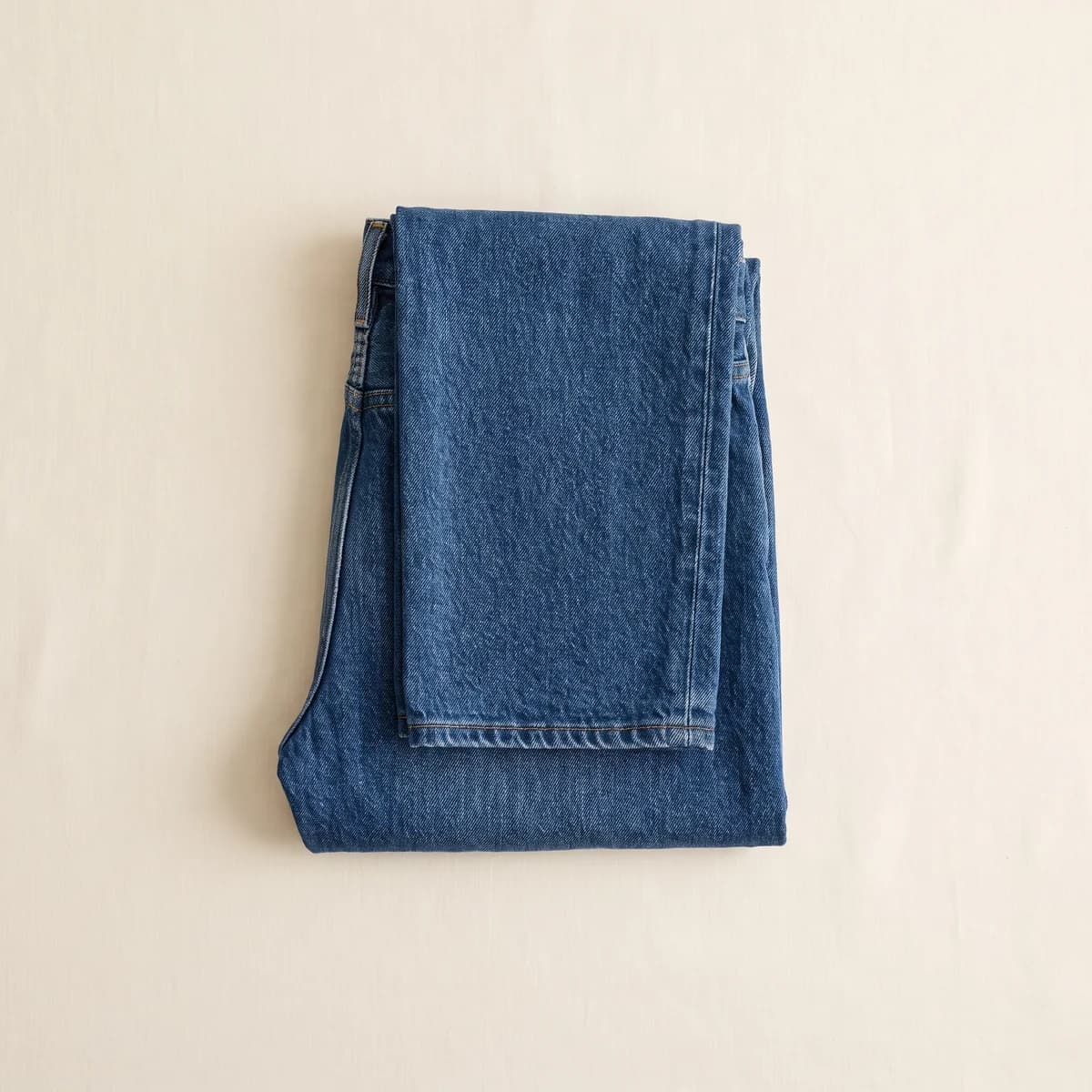 Folded mid-blue straight-leg jeans